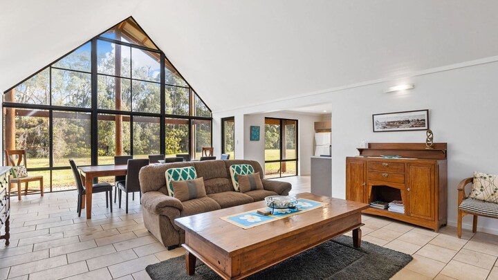 Lilly Pilly Cottage terrace with bistro table and chairs, timber door and landscaped path, Margaret River