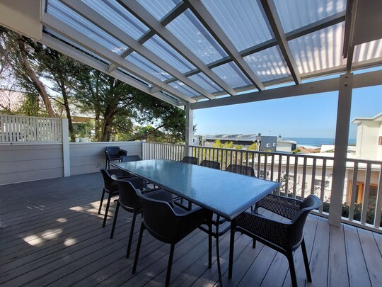 Lilly Pilly Cottage terrace with bistro table and chairs, timber door and landscaped path, Margaret River