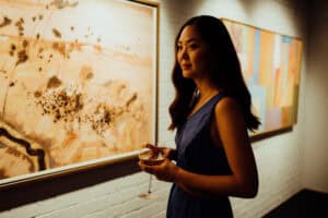 Woman admiring artwork inside the Leeuwin Estate Art Gallery in Margaret River. Kalbarri to Margaret River tour